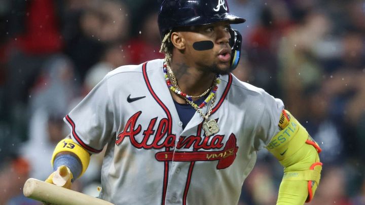 DENVER, COLORADO - AUGUST 28: Ronald Acuña Jr. #13 of the Atlanta Braves hits a two-run home run in the fifth inning against the Colorado Rockies at Coors Field on August 28, 2023 in Denver, Colorado. (Photo by Tyler Schank/Clarkson Creative/Getty Images)