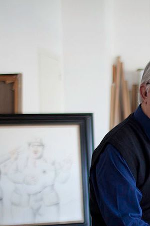Colombian painter and sculptor Fernando Botero sitting in his studio in front of a some paintings. Monte Carlo, 15th March 2012. (Photo by Massimo Sestini/Mondadori via Getty Images)