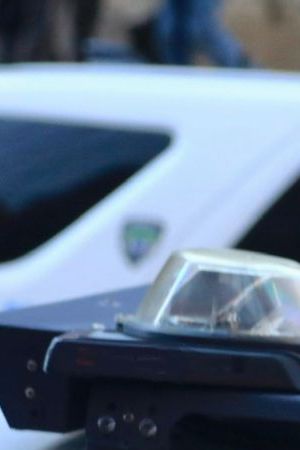 Police vehicles with overhead strobe lights at a crime scene - stock photo