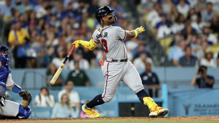 LOS ANGELES, CALIFORNIA - AUGUST 31: Ronald Acuña Jr. #13 of the Atlanta Braves hits a grand slam home run against starting pitcher Lance Lynn #35 of the Los Angeles Dodgers during the second inning at Dodger Stadium on August 31, 2023 in Los Angeles, California. Acuna Jr. became the first player with 30 home runs and 60 stolen bases in a season. (Photo by Kevork Djansezian/Getty Images)