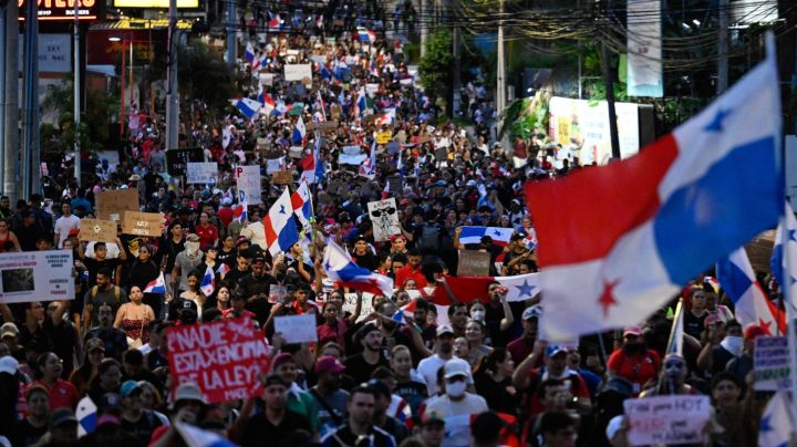 Demonstrators protest against the contract for the Canadian mining company FQM in Panama City, Panama 24 October 2023. Demonstrators and police clashed Tuesday in Panama as protests over a copper mine spilled into their fifth day, with President Laurentino Cortizo vowing he would prosecute acts of "vandalism." The protesters are concerned about potential environmental damage from operations at the mine owned by First Quantum, a Canadian firm and one of the biggest copper extractors in the world. After protests erupted on Friday and continued over the weekend, demonstrators had yet to let up by Tuesday in Panama City and in other provinces. (Photo by LUIS ACOSTA / AFP) (Photo by LUIS ACOSTA/AFP via Getty Images)