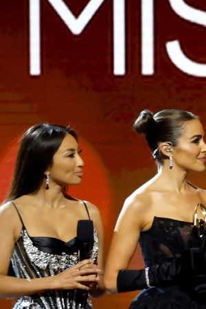 NEW ORLEANS, LOUISIANA - JANUARY 14: Jeannie Mai Jenkins, Olivia Culpo and Anne Jakrajutatip speak during The 71st Miss Universe Competition at New Orleans Morial Convention Center on January 14, 2023 in New Orleans, Louisiana. (Photo by Jason Kempin/Getty Images)