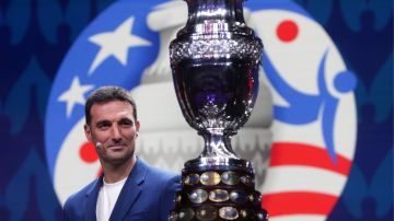MIAMI, FLORIDA - DECEMBER 07: Lionel Scaloni, Head Coach of Argentina, presents the Copa America trophy during the official draw of CONMEBOL Copa América 2024 at James L. Knight Center on December 07, 2023 in Miami, Florida. (Photo by Gustavo Pagano/Getty Images)