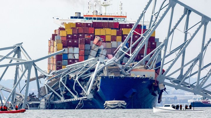 BALTIMORE, MARYLAND - MARCH 26: The cargo ship Dali sits in the water after running into and collapsing the Francis Scott Key Bridge on March 26, 2024 in Baltimore, Maryland. According to reports, rescuers are still searching for multiple people, while two survivors have been pulled from the Patapsco River. A work crew was fixing potholes on the bridge, which is used by roughly 30,000 people each day, when the ship struck at around 1:30am on Tuesday morning. The accident has temporarily closed the Port of Baltimore, one of the largest and busiest on the East Coast of the U.S. (Photo by Tasos Katopodis/Getty Images)
