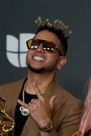 SEVILLE, ANDALUSIA, SPAIN - NOVEMBER 17: Singers Obi no the droo, Karol G and Santiago Alvarado, pose with the 3 Grammys they have been awarded during the Latin Grammy 2023 awards gala, at the Palacio de Congresos de Sevilla, on November 16, 2023, in Seville, Andalusia, Spain. Seville today hosted the 24th edition of the Latin Grammy Awards, which recognize artistic and technical excellence in Ibero-American music. This is the first time since 2000 that the Latin Grammy Awards have been held outside the United States and also the first time that the awards ceremony has been broadcast internationally. The gala could be followed on La 1 and RTVE Play. (Photo By Joaquin Corchero/Europa Press via Getty Images)