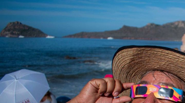 MAZATLAN, MEXICO - APRIL 08: A person watches the total solar eclipse at the beach on April 8, 2024 in Mazatlán, Mexico. Millions of people have flocked to areas across North America that are in the path of totality in order to experience a total solar eclipse. During the event, the moon will pass in between the sun and the Earth, appearing to block the sun. (Photo by Miguel Martínez Corona/ObturadorMX/Getty Images)