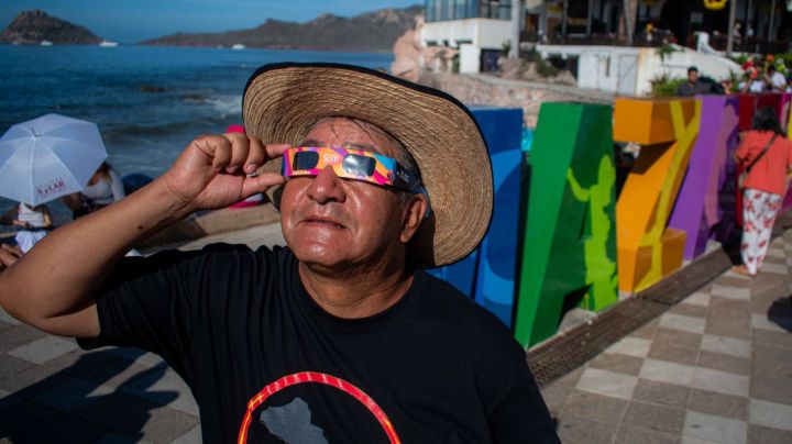 MAZATLAN, MEXICO - APRIL 08: A person watches the total solar eclipse at the beach on April 8, 2024 in Mazatlán, Mexico. Millions of people have flocked to areas across North America that are in the path of totality in order to experience a total solar eclipse. During the event, the moon will pass in between the sun and the Earth, appearing to block the sun. (Photo by Miguel Martínez Corona/ObturadorMX/Getty Images)