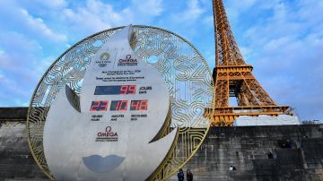 PARIS, FRANCE - APRIL 17: The official Omega Olympic countdown clock located beside the River Seine displays the remaining days until the Opening Ceremony of the Paris 2024 Olympic Games on April 17, 2024 in Paris, France. Paris will host the Summer Olympics from July 26 till August 11, 2024.(Photo by Franco Arland/Getty Images)