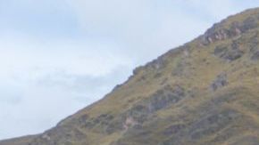 Three local female weavers in colourful traditional local dress including festooned hats, weaving colourful alpaca wool on the ground, Chumbe Community, Lamay, Sacred Valley, Peru (3 Model Releases and Property Release) - stock photo