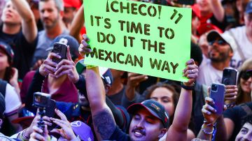A fan holds a banner in support of Sergio Perez of Mexico and Oracle Red Bull Racing in the fan zone prior to the Sprint Shootout ahead of the F1 Grand Prix of United States at Circuit of The Americas on October 21, 2023 in Austin, Texas. Photo by Mark Thompson/Getty Images