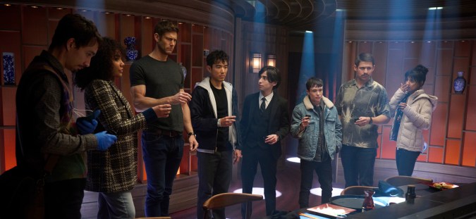 The Umbrella Academy. (L to R) Robert Sheehan as Klaus Hargreeves, Emmy Raver-Lampman as Allison Hargreeves, Tom Hopper as Luther Hargreeves, Justin H. Min as Ben Hargreeves, Aidan Gallagher as Number Five, Elliot Page as Viktor Hargreeves, David Castañeda as Diego Hargreeves, Ritu Arya as Lila Pitts in episode 401 of The Umbrella Academy. Cr. Christos Kalohoridis/Netflix © 2024