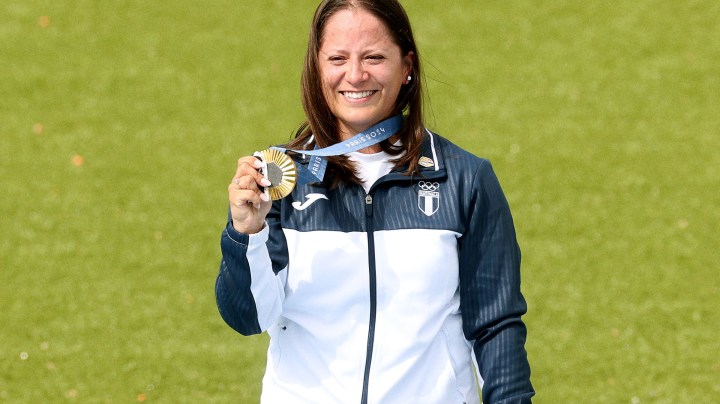 CHATEAUROUX, FRANCE - JULY 31: Gold medalist Adriana Ruano Oliva of Team Guatemala celebrates on the podium at the Shooting Trap Women’s medal ceremony on day five of the Olympic Games Paris 2024 at Chateauroux Shooting Centre on July 31, 2024 in Chateauroux, France. (Photo by Charles McQuillan/Getty Images)