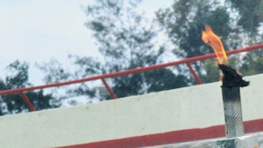 Enriqueta Basilio Waving on Olympic Grounds