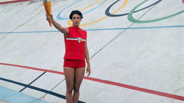 Enriqueta Basilio Waving on Olympic Grounds