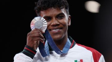 PARIS, FRANCE - JULY 30: Silver medalist Prisca Awiti Alcaraz of Team Mexico celebrates during the Women's Judo Women -63 kg medal ceremony on day four of the Olympic Games Paris 2024 at Champs-de-Mars Arena on July 30, 2024 in Paris, France. (Photo by Steph Chambers/Getty Images)
