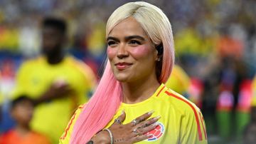 Colombian singer Karol G sings Colombia's national anthem before the Conmebol 2024 Copa America tournament final football match between Argentina and Colombia at the Hard Rock Stadium, in Miami, Florida on July 14, 2024. (Photo by Chandan Khanna / AFP) (Photo by CHANDAN KHANNA/AFP via Getty Images)