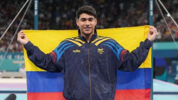 05 August 2024, France, Paris: Olympics, Paris 2024, gymnastics, high bar, men, final, Angel Barajas from Colombia celebrates silver. Photo: Marcus Brandt/dpa (Photo by Marcus Brandt/picture alliance via Getty Images)