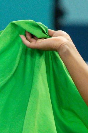 PARIS, FRANCE - AUGUST 5: Gold medal winner Rebeca Andrade of Brazil celebrates with the brazilian flag while women´s floor exercise final on day ten of the Olympic Games Paris 2024 at Bercy Arena on August 05, 2024 in Paris, France. (Photo by Rodolfo Buhrer/Eurasia Sport Images/Getty Images)