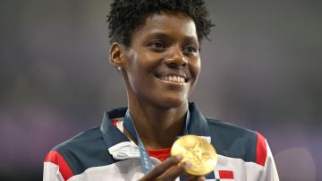 Paris , France - 9 August 2024; Marileidy Paulino of Team Dominican Republic celebrates with her women's 400m gold medal at the Stade de France during the 2024 Paris Summer Olympic Games in Paris, France. (Photo By Brendan Moran/Sportsfile via Getty Images)