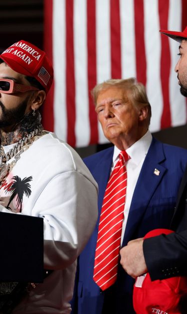 JOHNSTOWN, PENNSYLVANIA - AUGUST 30: Puerto Rican rapper Anuel AA (L) joins Republican presidential nominee, former U.S. President Donald Trump during a campaign rally in the 1st Summit Arena at the Cambria County War Memorial on August 30, 2024 in Johnstown, Pennsylvania. Promising to cut energy bills in half, conduct the largest deportation operation in history and put a 200% tariff on foreign made automobiles, Trump rallied his supporters in the all-important battleground state of Pennsylvania. (Photo by Chip Somodevilla/Getty Images)