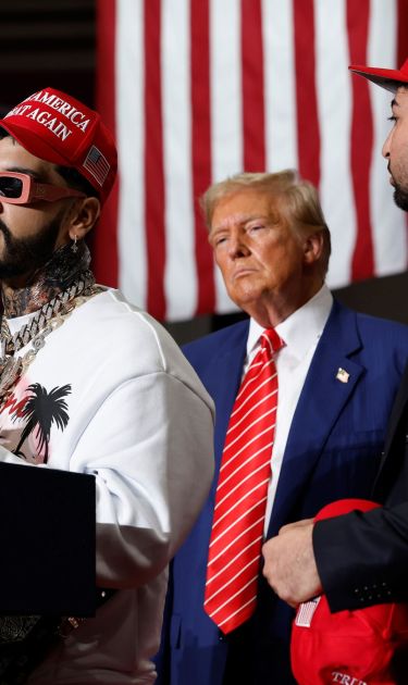JOHNSTOWN, PENNSYLVANIA - AUGUST 30: Puerto Rican rapper Anuel AA (L) joins Republican presidential nominee, former U.S. President Donald Trump during a campaign rally in the 1st Summit Arena at the Cambria County War Memorial on August 30, 2024 in Johnstown, Pennsylvania. Promising to cut energy bills in half, conduct the largest deportation operation in history and put a 200% tariff on foreign made automobiles, Trump rallied his supporters in the all-important battleground state of Pennsylvania. (Photo by Chip Somodevilla/Getty Images)