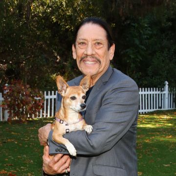 UNIVERSAL CITY, CALIFORNIA - SEPTEMBER 29: Actor Danny Trejo poses with a rescue dog on the set of Hallmark Channel's "Home & Family" at Universal Studios Hollywood on September 29, 2020 in Universal City, California. (Photo by Paul Archuleta/Getty Images)