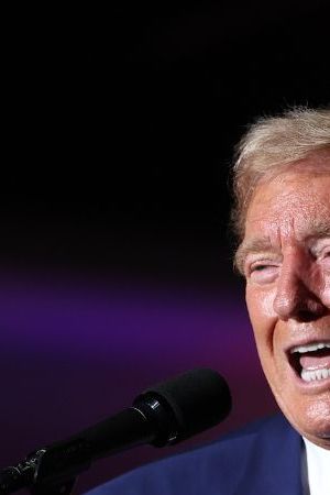 LAS VEGAS, NEVADA - SEPTEMBER 13: Republican presidential nominee, former U.S. President Donald Trump, (L) appears on stage with recording artist Nicky Jam during a campaign rally at The Expo at World Market Center Las Vegas on September 13, 2024 in Las Vegas, Nevada. With 53 days before election day, Former President Trump continues to campaign. (Photo by Justin Sullivan/Getty Images)