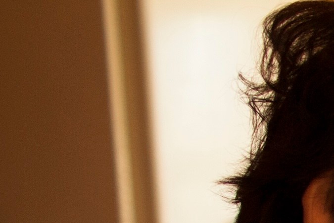 Hispanic woman cooking for granddaughter in kitchen - stock photo