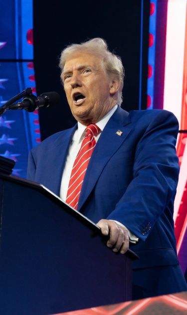 PHOENIX, ARIZONA - DECEMBER 22: U.S. President-elect Donald Trump speaks during Turning Point USA's AmericaFest at the Phoenix Convention Center on December 22, 2024 in Phoenix, Arizona. The annual four day conference geared toward energizing and connecting conservative youth hosts some of the country's leading conservative politicians and activists. (Photo by Rebecca Noble/Getty Images)