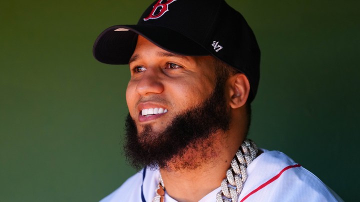 SANTO DOMINGO, DR - MARCH 10: El Alfa looks on from the dugout during batting practice prior to the game between the Tampa Bay Rays and the Boston Red Sox at Estadio Quisqueya on Sunday, March 10, 2024 in Santo Domingo, Dominican Republic. (Photo by Mary DeCicco/MLB Photos via Getty Images)