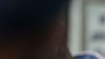 NEW YORK, NEW YORK - JUNE 6: An ICE agent monitors hundreds of asylum seekers being processed upon entering the Jacob K. Javits Federal Building on June 6, 2023 in New York City. New York City has provided sanctuary to over 46,000 asylum seekers since 2013, when the city passed a law prohibiting city agencies from cooperating with federal immigration enforcement agencies unless there is a warrant for the person's arrest.(Photo by David Dee Delgado/Getty Images)