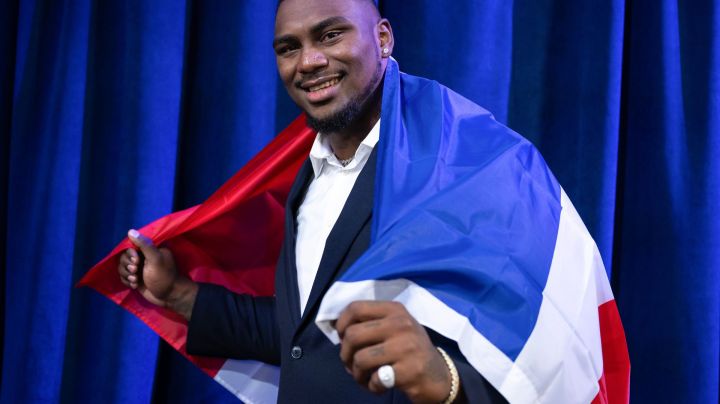 DETROIT, MICHIGAN - APRIL 27: Bayron Matos poses with the flag of the Dominican Republic during day 3 of the NFL Draft at Campus Martius Park and Hart Plaza on April 27, 2024 in Detroit, Michigan. (Photo by Luke Hales/Getty Images)