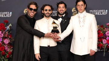 LOS ANGELES, CALIFORNIA - FEBRUARY 02: (L-R) Alejandro Abeijón, Alberto Montenegro, Antonio Casas, and Andrés Story of Rawayana winners of the Best Latin Rock or Alternative Album for “¿Quién trae las cornetas?”, poses in the press room during the 67th Annual GRAMMY Awards at Crypto.com Arena on February 02, 2025 in Los Angeles, California.  (Photo by Monica Schipper/Getty Images for The Recording Academy)