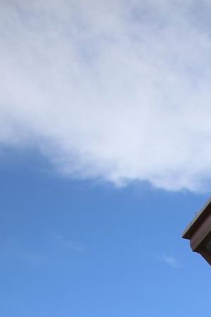 GUANTANAMO BAY, CUBA - JUNE 25: (EDITORS NOTE: Image has been reviewed by the U.S. Military prior to transmission.) A military officer walks from the entrance to Camp VI at the U.S. military prison for 'enemy combatants' on June 25, 2013 in Guantanamo Bay, Cuba. President Barack Obama has recently spoken again about closing the prison which has been used to hold prisoners from the invasion of Afghanistan and the war on terror since early 2002. (Photo by Joe Raedle/Getty Images)