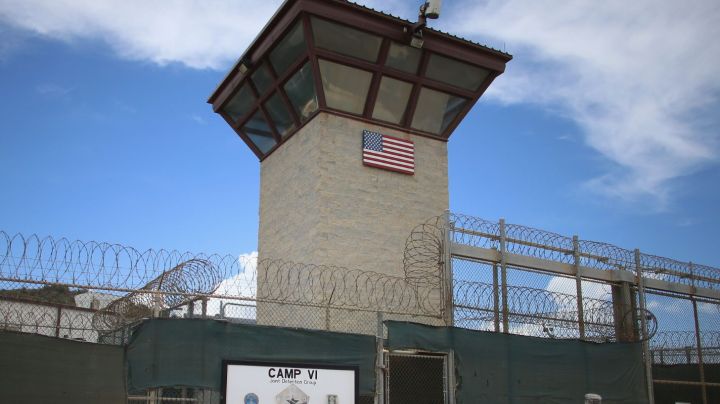 GUANTANAMO BAY, CUBA - JUNE 25: (EDITORS NOTE: Image has been reviewed by the U.S. Military prior to transmission.) A military officer walks from the entrance to Camp VI at the U.S. military prison for 'enemy combatants' on June 25, 2013 in Guantanamo Bay, Cuba. President Barack Obama has recently spoken again about closing the prison which has been used to hold prisoners from the invasion of Afghanistan and the war on terror since early 2002. (Photo by Joe Raedle/Getty Images)