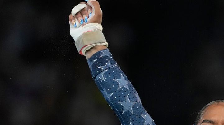 Jordan Chiles, of the United States, celebrates after performing on the uneven bars during the women's artistic gymnastics team finals round at Bercy Arena at the 2024 Summer Olympics, Tuesday, July 30, 2024, in Paris, France. (AP Photo/Natacha Pisarenko)