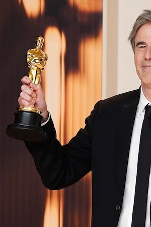 Walter Salles, winner of the award for "I'm Still Here" from Brazil, for best international feature film, poses in the press room at the Oscars on Sunday, March 2, 2025, at the Dolby Theatre in Los Angeles. (Photo by Jordan Strauss/Invision/AP)