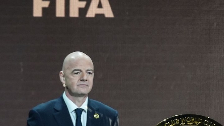 FIFA Club_FIFA President Gianni Infantino' and Former professional Brazilian soccer player Ronaldo present a new trophy during the draw for the 2025 FIFA Club World Cup soccer tournament, Thursday, Dec. 5, 2024, in Miami. (AP Photo/Rebecca Blackwell)
