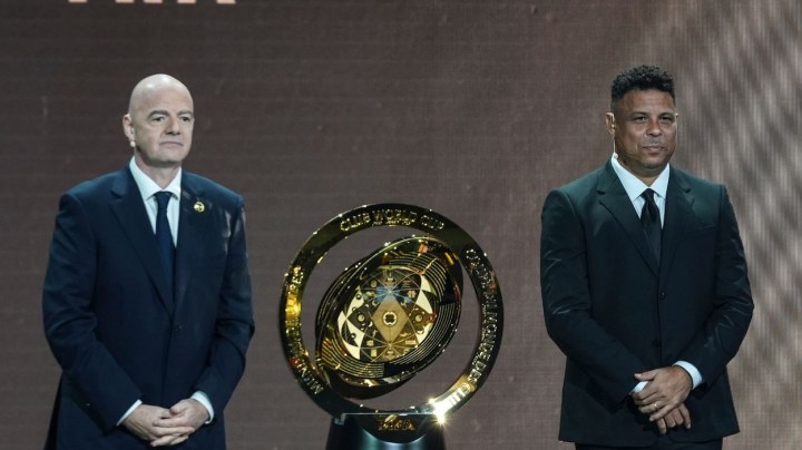 FIFA Club_FIFA President Gianni Infantino' and Former professional Brazilian soccer player Ronaldo present a new trophy during the draw for the 2025 FIFA Club World Cup soccer tournament, Thursday, Dec. 5, 2024, in Miami. (AP Photo/Rebecca Blackwell)