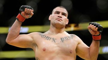 Cain Velasquez celebrates after defeating Travis Browne in their heavyweight mixed martial arts bout at UFC 200, Saturday, July 9, 2016, in Las Vegas. (AP Photo/John Locher)