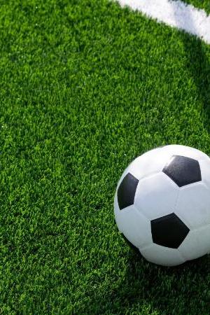 Black and white soccer and football ball in the field. Horizontal sport theme poster, greeting cards, headers, website and app