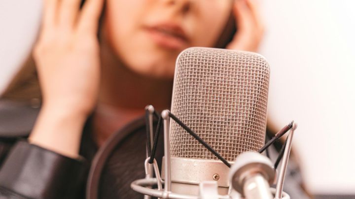 woman singing in microphone