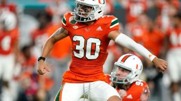 Miami place kicker Andres Borregales (30) watches after attempting a field goal during the closing seconds of an NCAA college football game against Virginia, Thursday, Sept. 30, 2021, in Miami Gardens, Fla. Borregales missed the field goal and Virginia won 30-28. (AP Photo/Lynne Sladky)