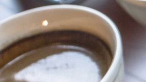 Table with multiple different kinds of coffees on it