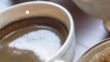 Table with multiple different kinds of coffees on it