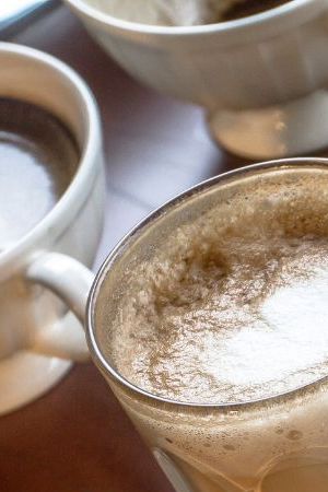 Table with multiple different kinds of coffees on it
