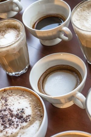 Table with multiple different kinds of coffees on it