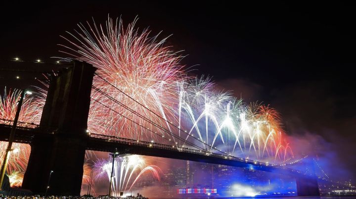 FILE - In this July 4, 2019 file photo, fireworks light up the sky above the Brooklyn Bridge during Macy's Fourth of July fireworks show in New York. The Macy's Fourth of July fireworks show will return to New York City this year. (AP Photo/Frank Franklin II, File)