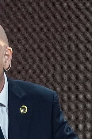 FILE - FIFA President Gianni Infantino' speaks next to the trophy during the draw for the 2025 FIFA Club World Cup soccer tournament, Thursday, Dec. 5, 2024, in Miami. (AP Photo/Rebecca Blackwell, File)