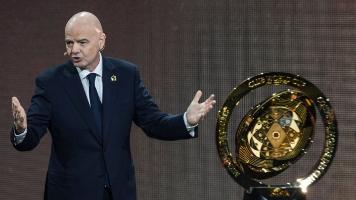 FILE - FIFA President Gianni Infantino' speaks next to the trophy during the draw for the 2025 FIFA Club World Cup soccer tournament, Thursday, Dec. 5, 2024, in Miami. (AP Photo/Rebecca Blackwell, File)